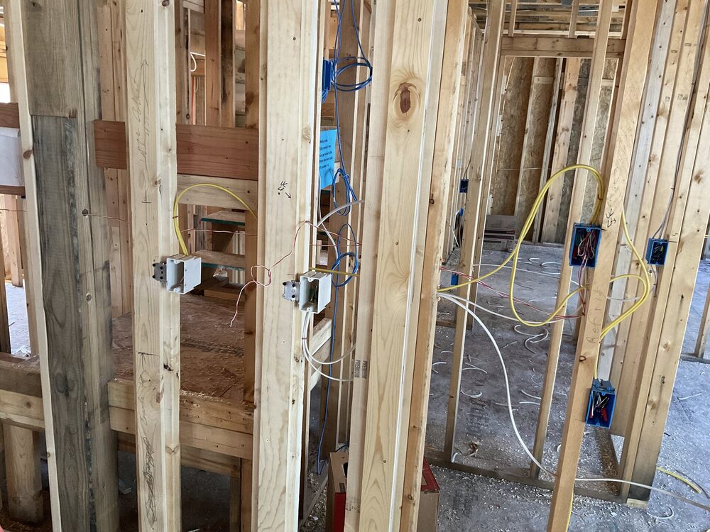 Wall rough-in with multiple device boxes and Romex runs