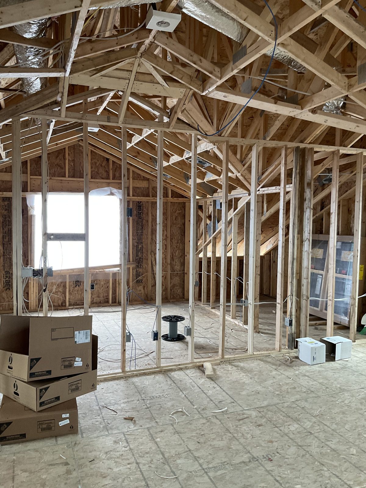 New construction rough-in under vaulted-ceiling framing