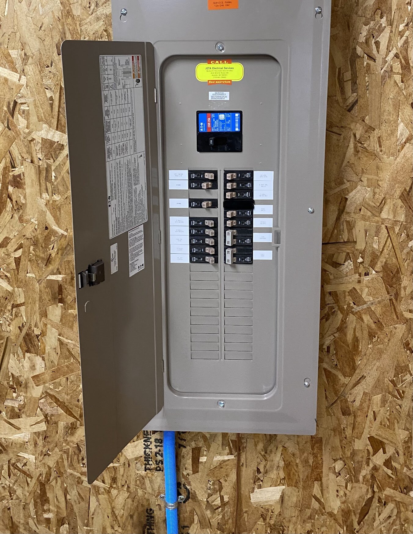 Clean, finished electrical panel install by JETA Electric