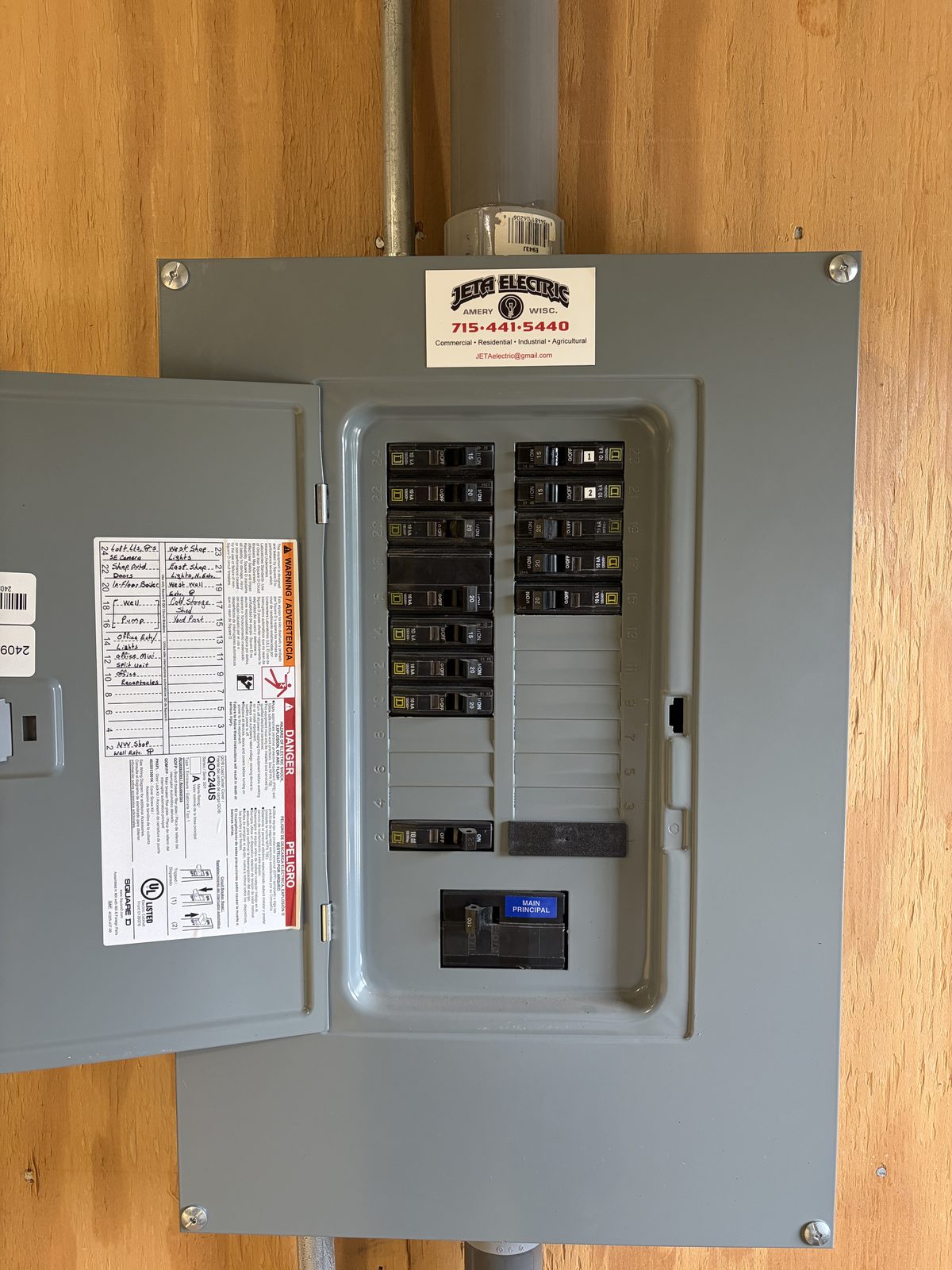 Square D panel upgrade with JETA Electric branded sticker — dressed conductors, labeled directory